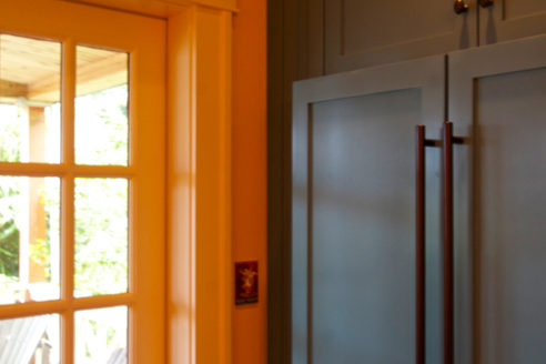 Painted refrigerator custom wood panels & hardware.