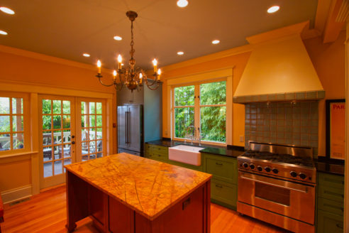 Custom tile & painted stove hood cover.