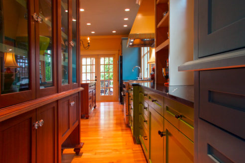 Mahogany pantry base includes interior pet dining nook.