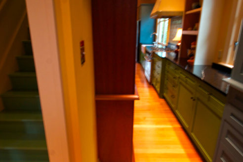 Painted green steps in back stairwell.
